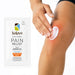 Hand applying white Kalaya Extra Strength Pain Relief Emulsion Gel with Arnica to a sore knee, with the pain relief sachet displayed beside the application area, illustrating topical use for temporary relief of minor aches and joint discomfort.