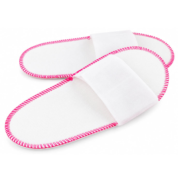 a pair of Non woven disposable open toe slippers in white color with pink stitches