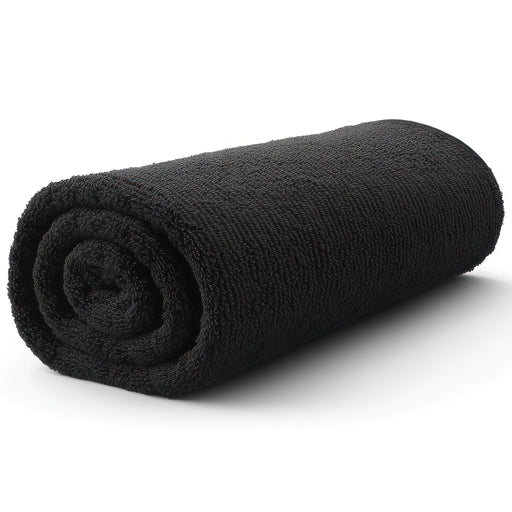 Rolled-up black towel on a white background