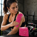 TheraBand Kinesiology Tape applied to shoulder and arm for muscle support during exercise and sports