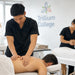 Trillium College massage therapy students practicing professional massage techniques on clients in a clinical training classroom.