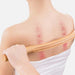 Set of 4 Natural Wood Gua Sha Scraping Sticks demo being used on back