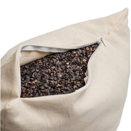 opened buckwheat pillow showing buckwheat hulls