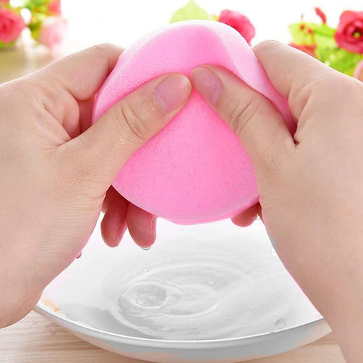 Pink Cellulose Sponge being held by model