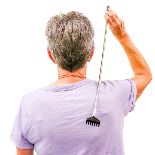 Woman in purple shirt using the Extendable Stainless Steel Back Scratcher