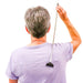 Woman in purple shirt using the Extendable Stainless Steel Back Scratcher