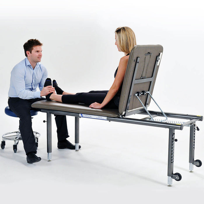 Cardon Adjustable Height Treatment Table (AHT)  female sitting up