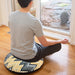Comfy Comfy Meditation Pillow male model sitting on pillow