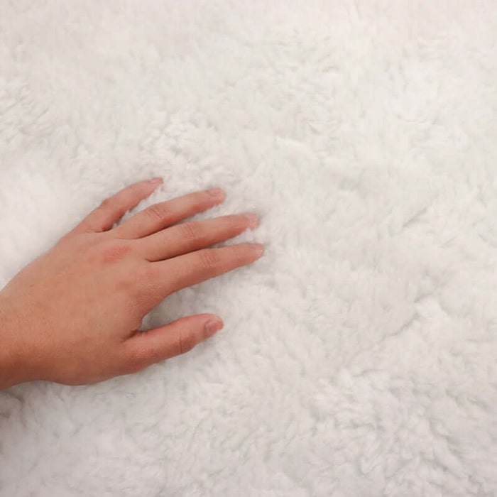 Abundance Fleece Massage Table Pad Set hand on fleece